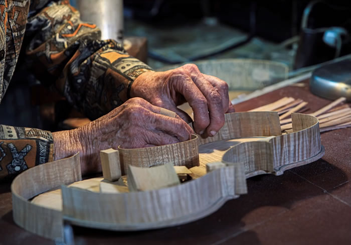 Anne working on a violin